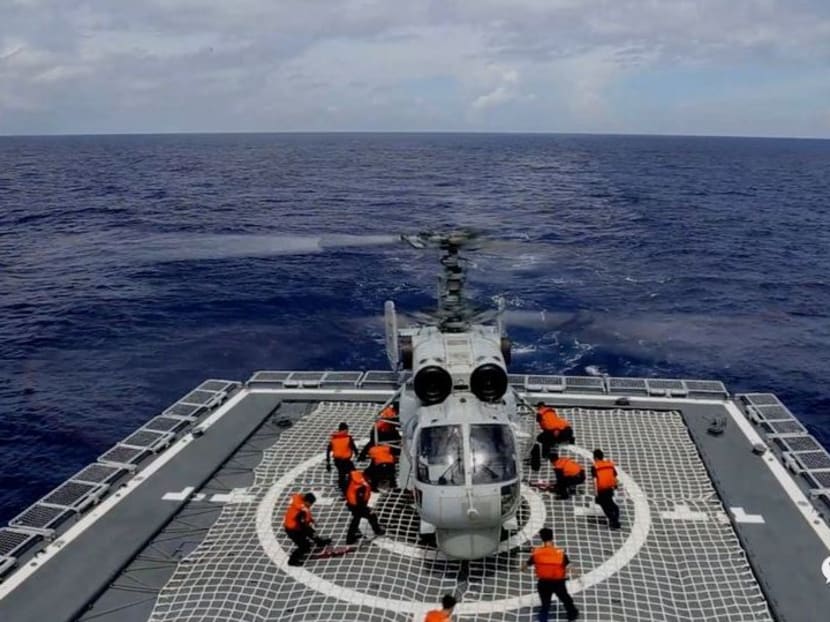 A Navy Force helicopter under the Eastern Theatre Command of China's People's Liberation Army (PLA) takes part in military exercises in the waters around Taiwan, at an undisclosed location Aug 8, 2022 in this handout picture released on Aug 9, 2022. 