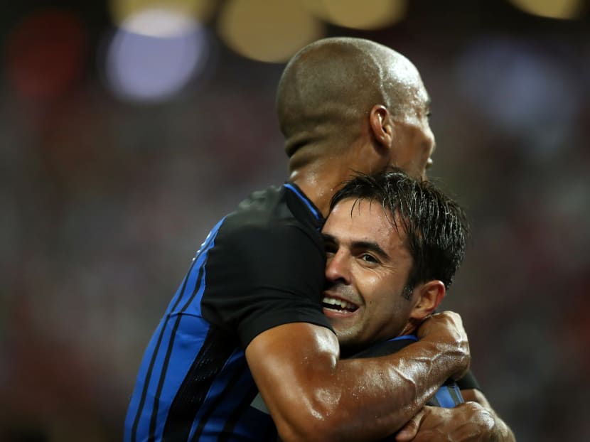 Inter Milan's Eder Martins celebrates with teammate Joao Mario after scoring. Photo: Reuters