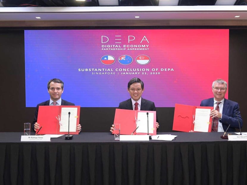 Left to right: Mr Rodrigo Yanez, Chile's Vice-Minister for Trade, Singapore's Trade and Industry Minister Chan Chun Sing and Mr David Parker, New Zealand's Minister for Trade and Export Growth, conclude negotiations on a landmark deal on digital trade on Jan 21, 2020.