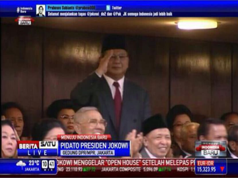 Mr Prabowo Subianto salutes President Joko Widodo at the latter's inauguration. Photo: BeritaSatu TV