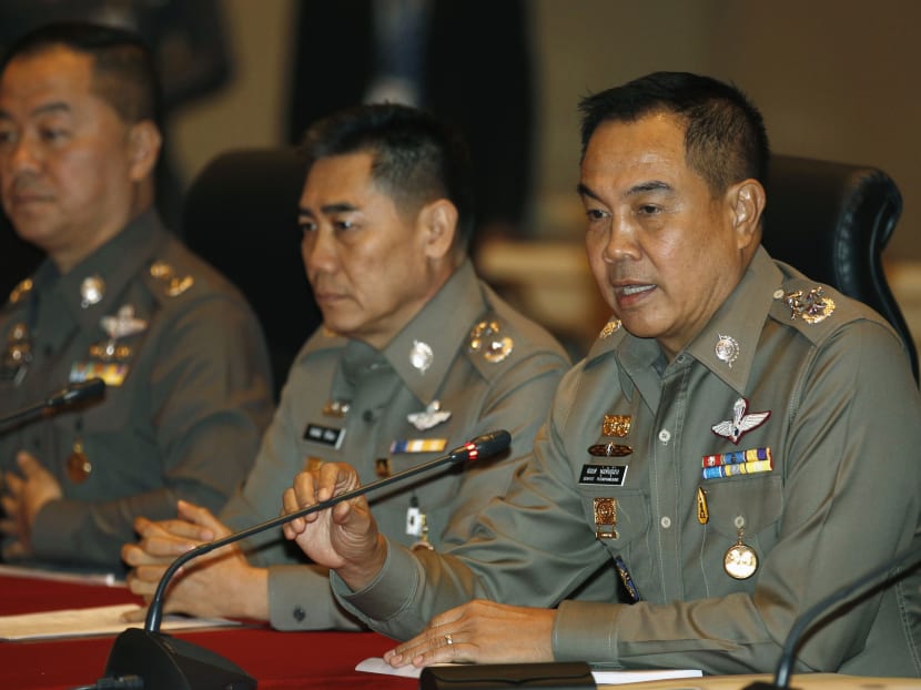 Chief of Royal Thai Police General Somyot Poompanmuang (right) speaks during a news conference at the Royal Thai Police headquarters in Bangkok on Nov 25, 2014. Photo: REUTERS