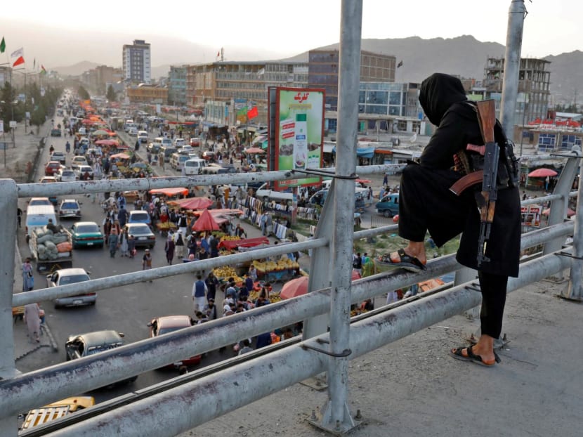 A Taliban fighter stands guard on a bridge in Kabul, Afghanistan, Aug 6, 2022. A Taliban fighter stands guard on a bridge in Kabul, Afghanistan, Aug 6, 2022.