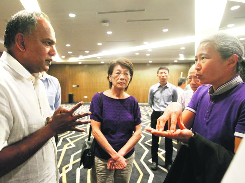 Minister for Foreign Affairs and Law K Shanmugam with members of the Singapore Island Country Club, after the meeting on the land leases of golf clubs yesterday. Photo: Ernest Chua