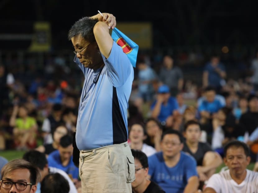 A Workers’ Party supporter looking dejected. Photo: Don Wong/TODAY