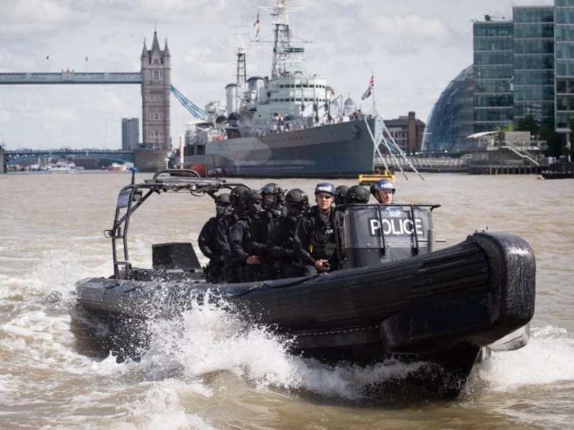 Armed Metropolitan Police counter terrorism officers take part in an exercise on the River Thames in London on August 3, 2016. Photo: AFP