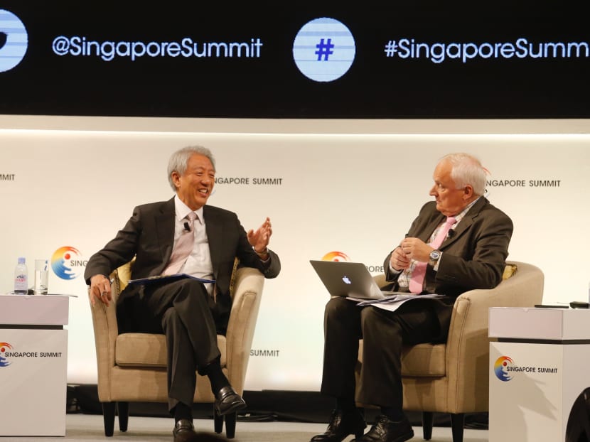Deputy Prime Minister Teo Chee Hean (left) with visiting professor Nanyang Technological University  Nik Gowing who was moderating the dialogue session on Friday (Sept 15). Photo: Najeer Yusof/TODAY