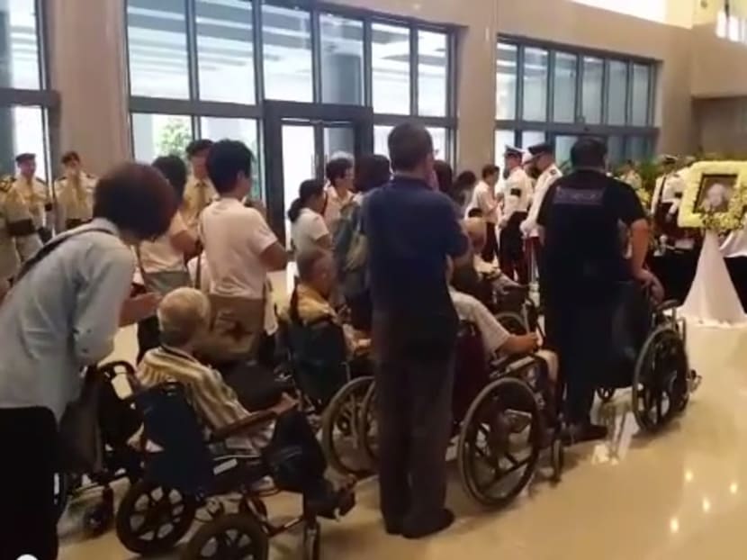 Group of elderly in wheelchairs pay their respect to Mr Lee Kuan Yew