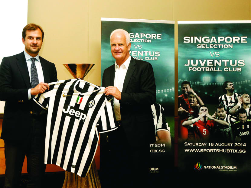 Juventus commercial director Francesco Calvo (left)  with Singapore national coach Bernd Stange during the media lunch at the Fullerton Hotel yesterday. 
Photo: Wee Teck Hian