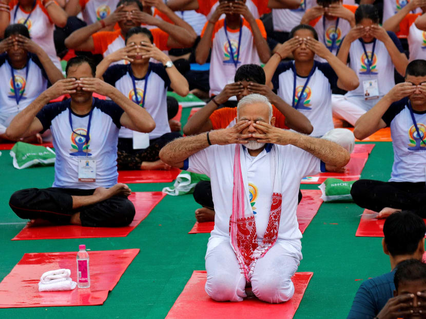 Indian Prime Minister Narendra Modi performs yoga on International Yoga Day in Lucknow, India. Photo: Reuters