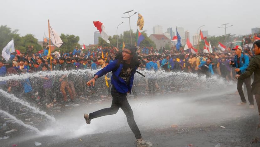 Indonesia police fire tear gas as protesters rally against graft law, Bill banning pre-marital sex Indonesia police fire tear gas as protesters rally against graft law, Bill banning pre-marital sex