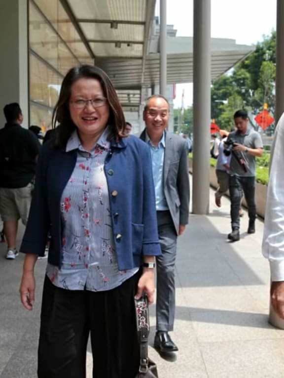 Workers’ Party figures Sylvia Lim and Low Thia Khiang (back) at the Supreme Court in a file photo.