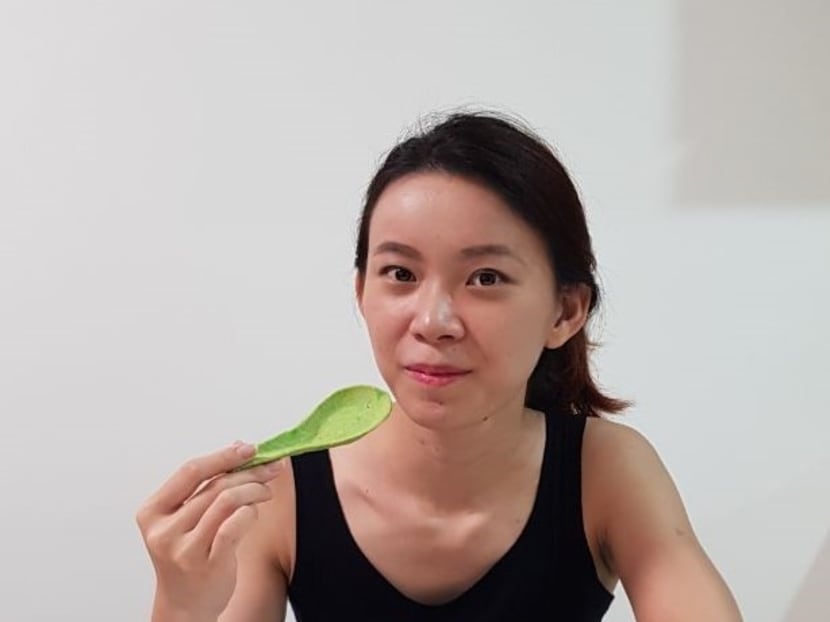 The author with an edible spoon she created. Since young, she has harboured dreams of starting a business in her younger days but felt it was risky and better for her to get a corporate job.