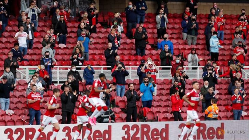 Football: Face masks and no hugging for returning Premier League fans Football: Face masks and no hugging for returning Premier League fans