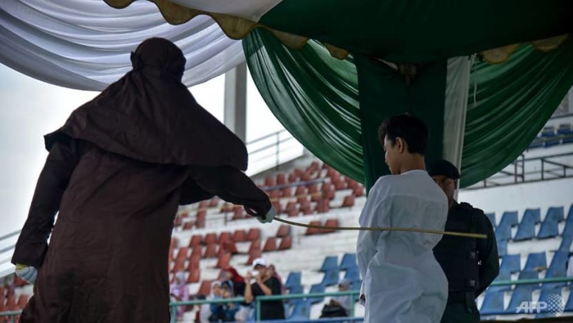Indonesia's Aceh whips two men, woman for breaking sharia law
