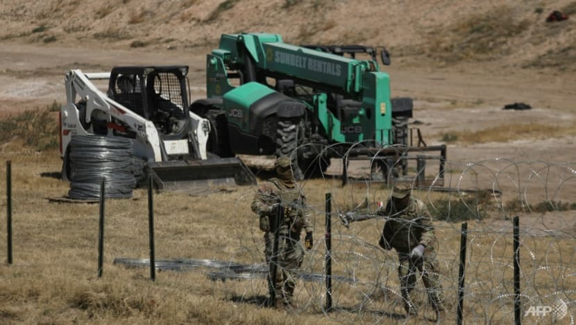 US to review migrants abroad, toughen penalties in revamp
