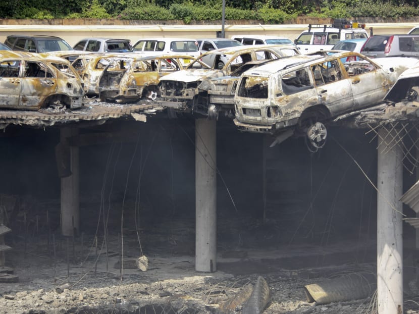 This photo released by the Kenya Presidency shows the collapsed upper car park of the Westgate Mall in Nairobi, Kenya Thursday, Sept 26, 2013. Photo: AP