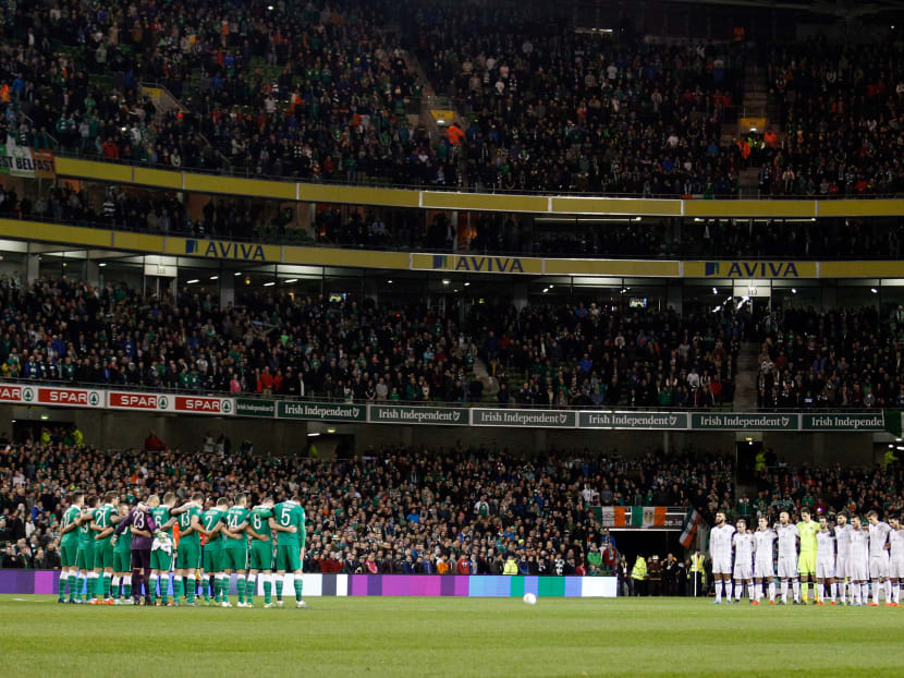 Players of Ireland, left, and Bosnia observe a minute of silence for victims of the Paris attacks before the Euro 2016 play-off second leg soccer match between Ireland and Bosnia in Dublin Monday, Nov. 16, 2015. Photo: AP