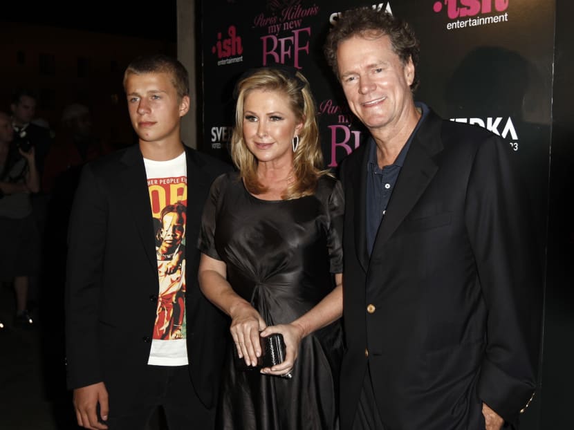 In this Sept 30, 2008 file photo, Conrad Hilton, left, Kathy Hilton, centre, and Rick Hilton arrive at the launch party of new MTV series Paris Hilton's My New BFF in Los Angeles. Photo: AP