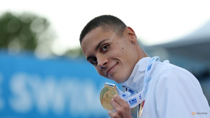 Romania's Popovici breaks world 100m freestyle record at European championships Romania's Popovici breaks world 100m freestyle record at European championships