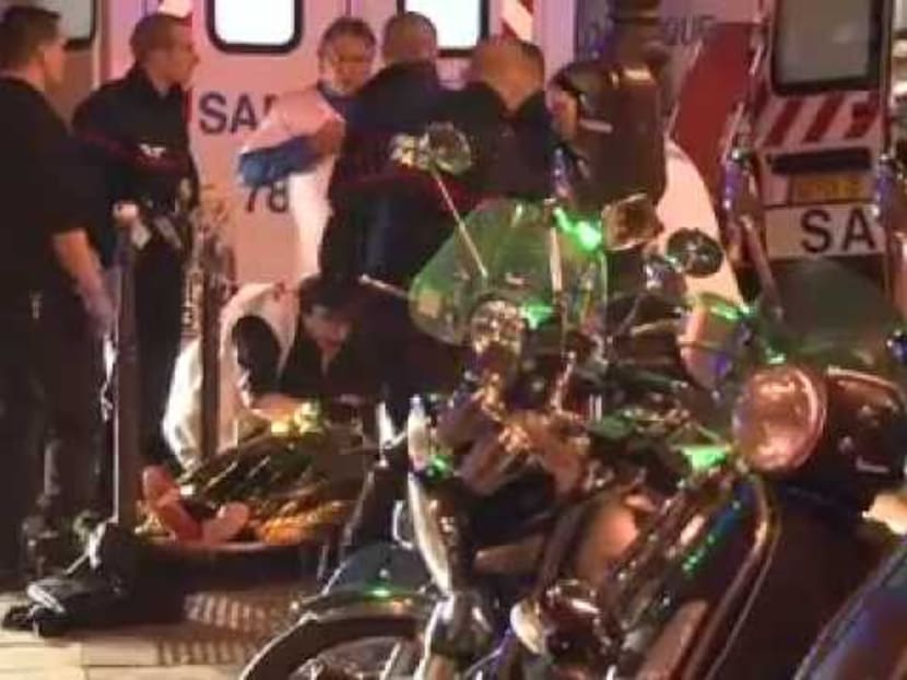 Medics evacuate injured from Bataclan concert venue in Paris