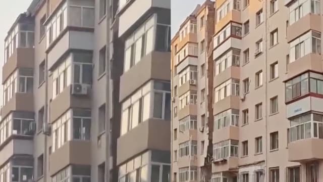 中国哈尔滨一栋楼倾斜开裂 附近居民：闻到煤气味