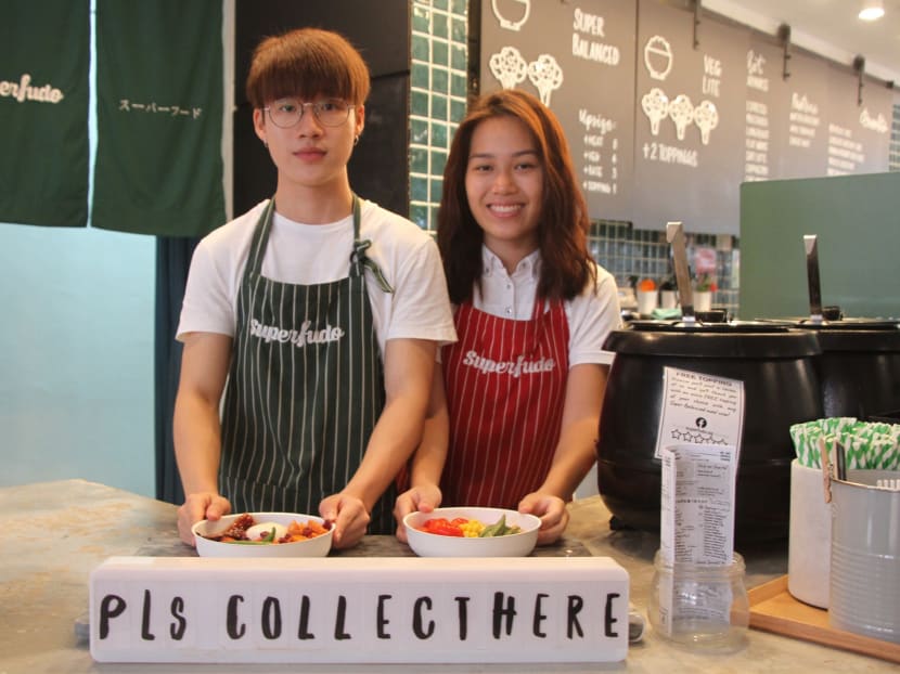 Superfudo's part-time service crew (from left) Han Shao Zhuo, 21 and Liz Wee, 18. They are part of an entirely student-run crew, down to its managers. Superfudo's part-time service crew (from left) Han Shao Zhuo, 21 and Liz Wee, 18. They are part of an entirely student-run crew, down to its managers.