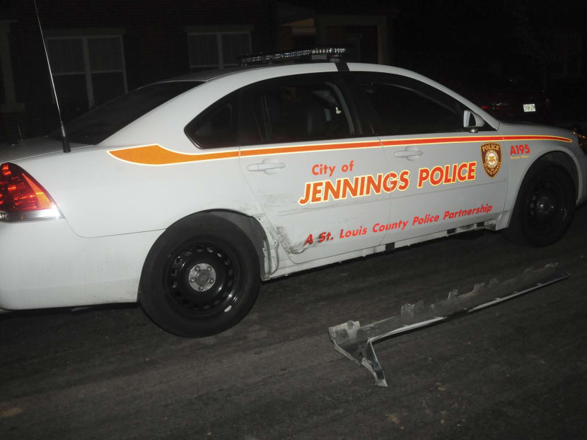 A St. Louis County police car shows damage that police say was caused by a suspect in a shooting incident in Jennings, Missouri in this Sept 17, 2014 handout photo. Photo: Reuters