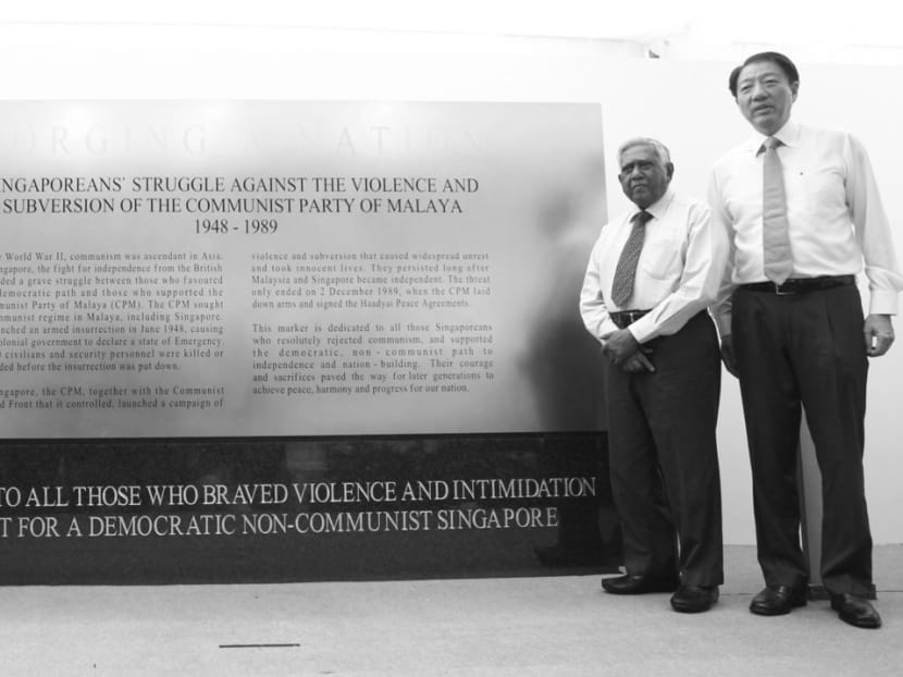 (From left) Minister for Culture, Community and Youth Lawrence Wong, former PAP Member of Parliament and NTUC co-founder Mahmud Awang, who was on the front line of the fight against the communists, former President S R Nathan and Deputy Prime Minister Teo Chee Hean at the unveiling of the Struggle against the Communist Party of Malaya marker on Monday. TODAY File Photo