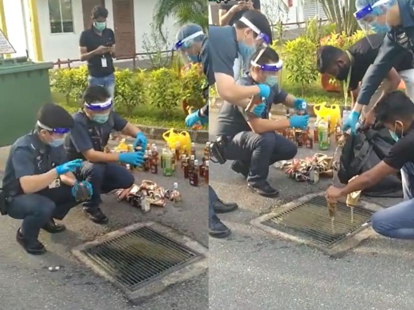 A video posted on the Singapore Road Accident Facebook page on Thursday afternoon showed uniformed officers emptying bottles of what looked like beer and liquor into a drain.