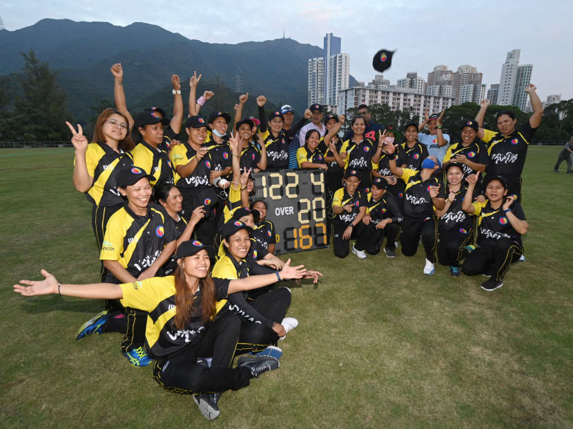 Members of the SCC Divas cricket team, made up of domestic helpers from the Philippines, celebrating their win against the Hong Kong Cricket Club Cavaliers in Hong Kong on Nov 8, 2020.