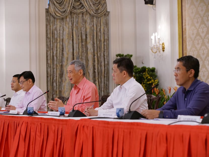 Prime Minister Lee Hsien Loong (third from right) and several political officeholders, during the announcement of the latest Cabinet appointments on July 25, 2020.