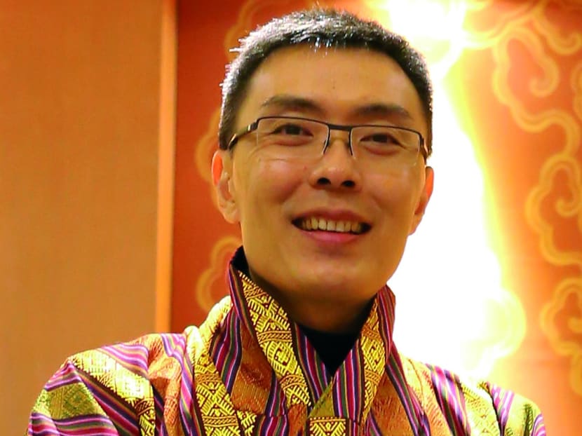Steven Chua, in traditional Bhutanese garb, wants to welcome visitors to Bhutan.
