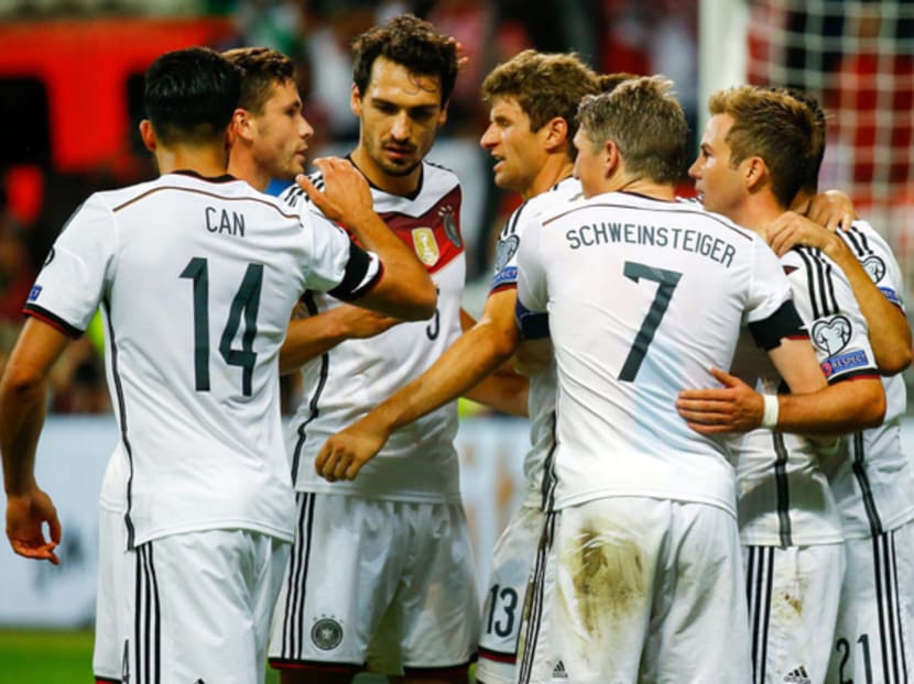 Thomas Mueller (third from right) scored twice and set up another goal for Germany against Scotland. Photo: Reuters
