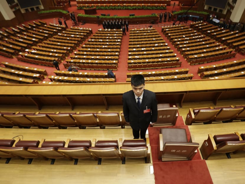 A plainclothes soldier keeps watch after the opening of the annual full session of the National People's Congress (NPC), the country's parliament, at Great Hall of the People, in Beijing, March 5, 2015. Photo: Reuters