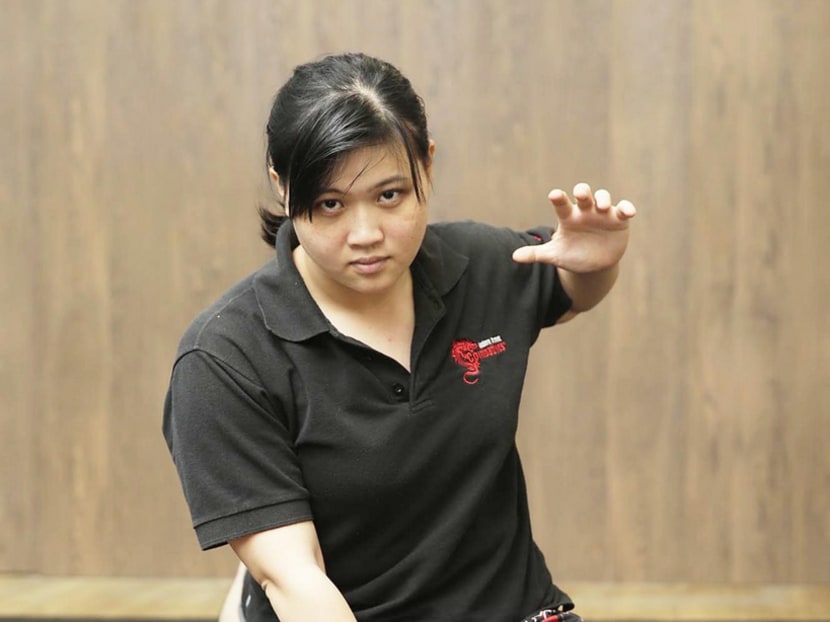 Kapap instructor Qin Yunquan has faced scepticism for being in a male-dominated industry, but continues to train thousands in self-defence, including abused women, foreign domestic helpers, the deaf and blind, as well as the elderly. PHOTO: WEE TECK HIAN