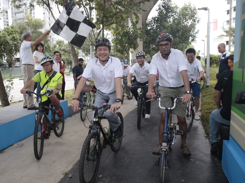 Cyclists, including Acting Education Minister (Schools) Ng Chee Meng, begin to cycle along cycling paths as DPM Teo Chee Hean flags off, at The launch of the Punggol cycling path network on Oct 30, 2016. Photo: Jason Quah