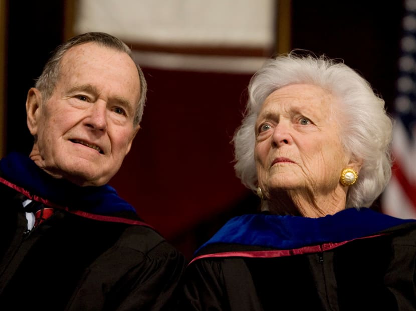 FILE PHOTO - Former President George H.W. Bush (L), and former first lady Barbara Bush attend the Texas A&M University commencement ceremony in College Station, Texas, December 12, 2008.  Photo: Reuters