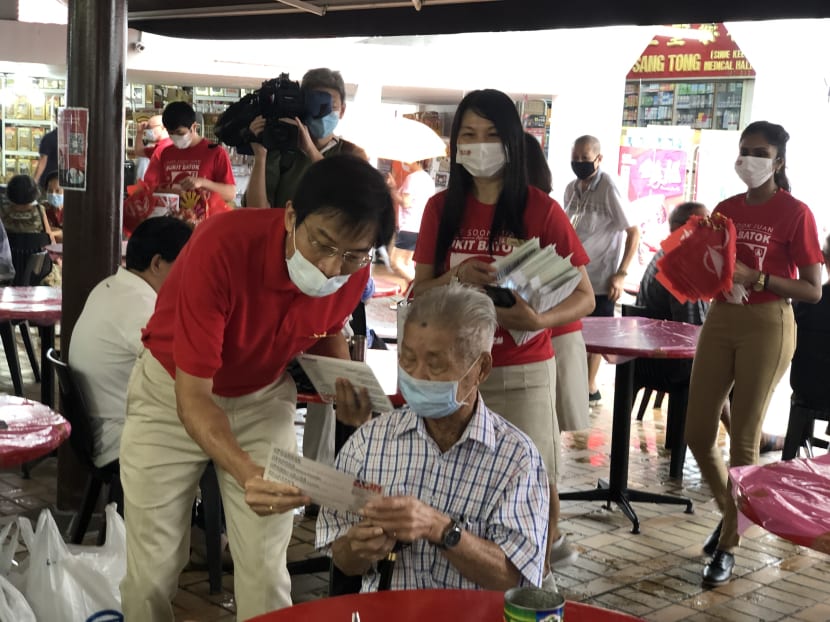 Dr Chee Soon Juan speaking to a resident during his walkabout in Bukit Batok on June 21, 2020.
