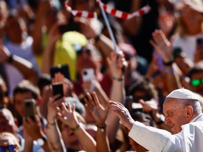 FILE PHOTO: Pope Francis greets people as he arrives for the weekly general audience on the day he is due to undergo abdominal surgery, in St. Peter's Square at the Vatican, June 7, 2023. REUTERS/Yara Nardi