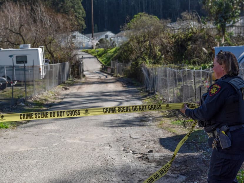 San Mateo Sheriff protects the police line at one of the crime scenes, the day after a mass shooting at two locations in the coastal city of Half Moon Bay, California, on Jan 24, 2023. 