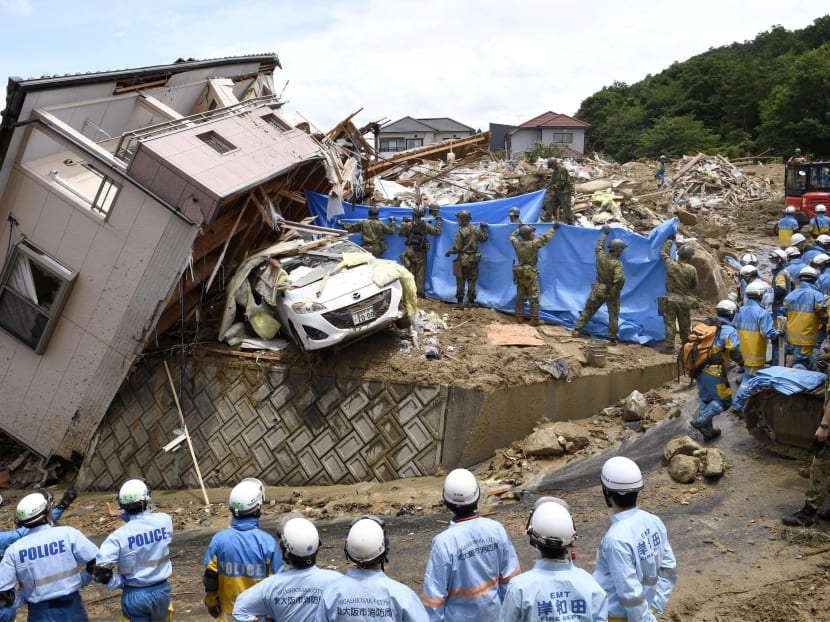 Photo of the day: Rescue workers in Japan look for missing people in a house damaged by heavy rain in Kumano town in Hiroshima Prefecture. Torrential rains unleashed floods and landslides that killed more than 100 people, with dozens missing.