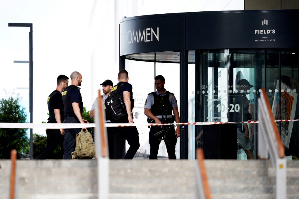 Police arrive to the Fields shopping mall, a day after a deadly shooting in Copenhagen on July 4, 2022. Danish police said that the 22-year-old suspect in a weekend shooting at a Copenhagen mall that left three dead was known to mental health services. Police arrive to the Fields shopping mall, a day after a deadly shooting in Copenhagen on July 4, 2022. Danish police said that the 22-year-old suspect in a weekend shooting at a Copenhagen mall that left three dead was known to mental health services.