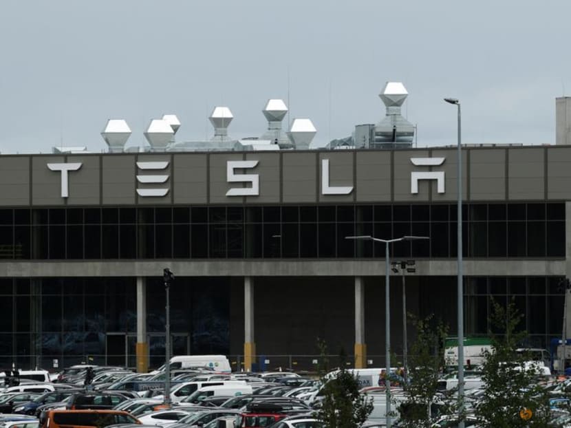 FILE PHOTO: A general view shows the Tesla logo on the Gigafactory in Gruenheide near Berlin, Germany, August 30, 2022. REUTERS/Annegret Hilse FILE PHOTO: A general view shows the Tesla logo on the Gigafactory in Gruenheide near Berlin, Germany, August 30, 2022. REUTERS/Annegret Hilse
