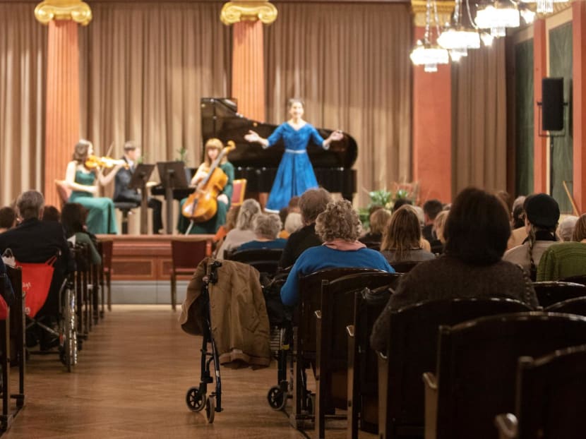 Spectators needing a walking aid attend a concert specifically tailored to people living with dementia at the Wiener Musikverein in Vienna on Dec 5, 2022. 

