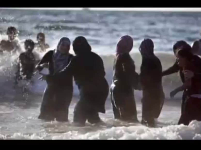 YouTube screengrab of women in full-body bathing suits, also known as burkinis, in Cannes, France.