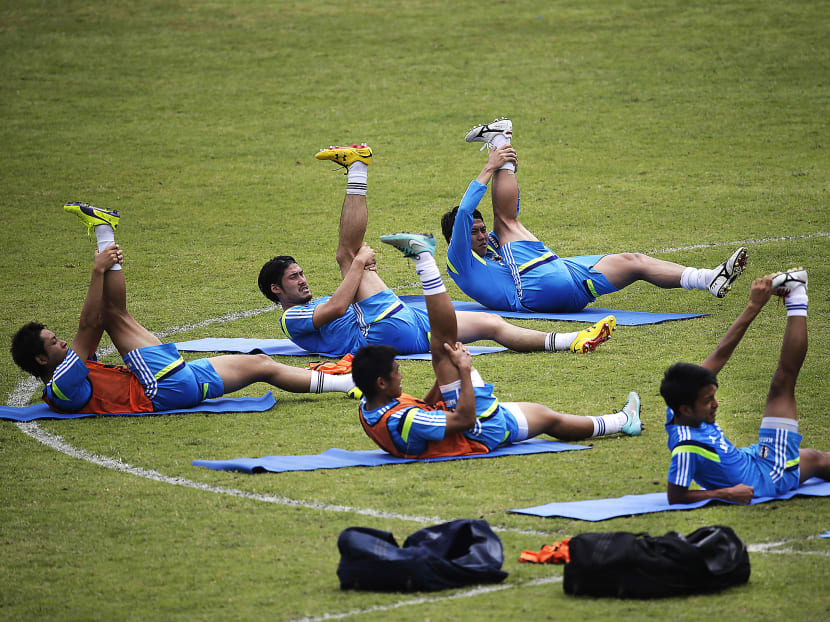 The Samurai Blue were hard at work during training at the Bishan Stadium yesterday. PHOTO: AP