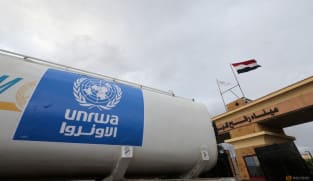 A truck, marked with United Nations Relief and Works Agency (UNRWA) logo, crosses into Egypt from Gaza, at the Rafah border crossing between Egypt and the Gaza Strip, during a temporary truce between Hamas and Israel, in Rafah, Egypt, Nov 27, 2023.
