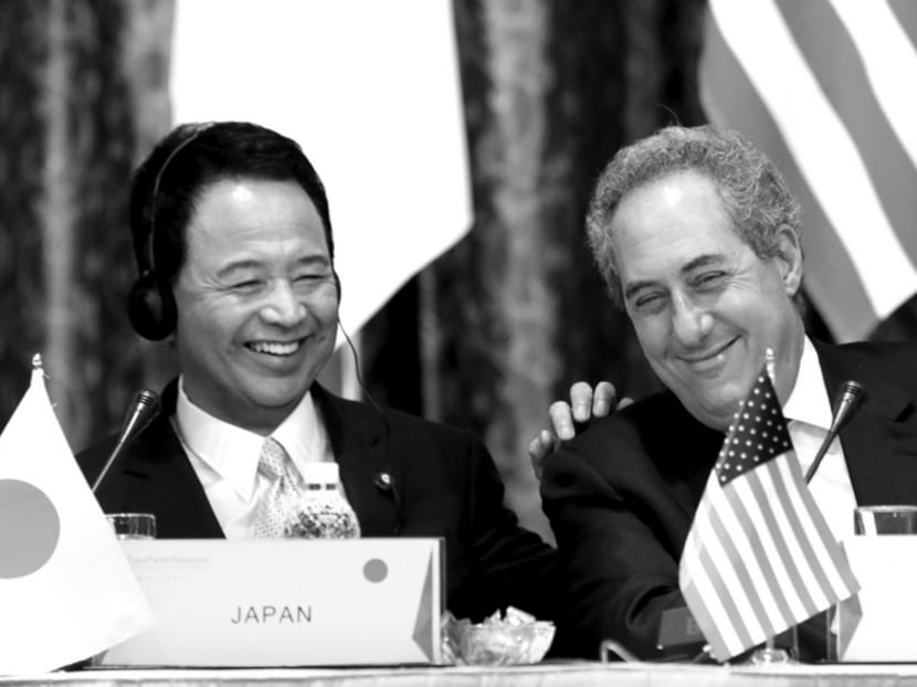Japan’s Economics Minister Akira Amari (left) and US Trade Representative Michael Froman at a ministerial meeting in February. The TPP will bind two of the world’s biggest economies into a bloc covering 40 per cent of global output. Photo: Reuters