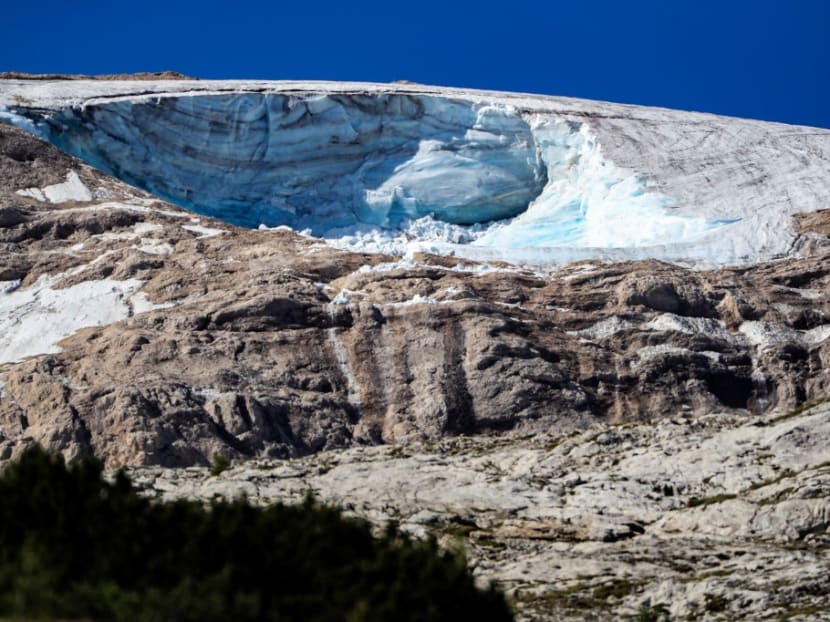 This view taken on July 4, 2022 shows the glacier that collapsed the day before on the mountain of Marmolada, the highest in the Dolomites, one day after a record-high temperature of 10°C was recorded at the glacier's summit. This view taken on July 4, 2022 shows the glacier that collapsed the day before on the mountain of Marmolada, the highest in the Dolomites, one day after a record-high temperature of 10°C was recorded at the glacier's summit. 
