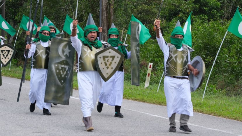Islamic party in Malaysia under probe after members stage march with fake swords, spears and shields